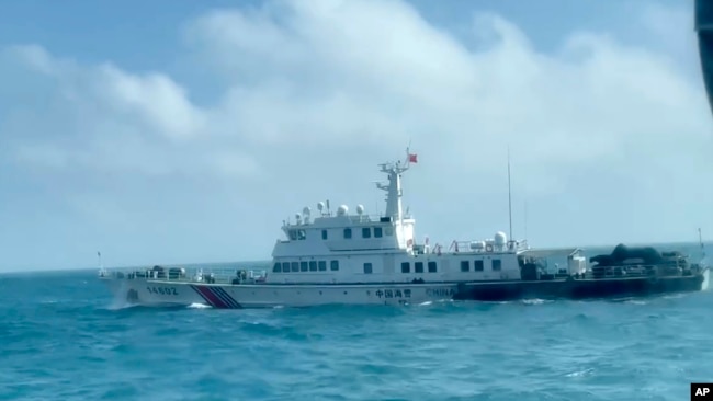 In this screen grab from video released by the Taiwan Coast Guard, a view of a China Coast Guard boat from a Taiwan Coast Guard boat as it passes near the coast of Matsu islands, Taiwan on Oct. 14, 2024. (Taiwan Coast Guard via AP)