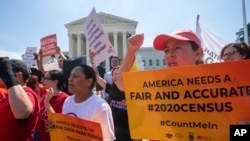 Demonstrators gather at the Supreme Court as the justices finish the term with decisions on gerrymandering and a census case involving a bid by the Trump administration to ask everyone about their citizenship status in the 2020 census, July 27, 2019.