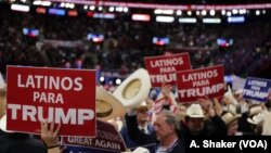 Latino delegates wave signs for Donald Trump at the Republican National Convention, in Cleveland, July 21, 2016.
