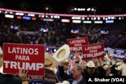 Latino delegates wave signs for Donald Trump at the Republican National Convention, in Cleveland, July 21, 2016.