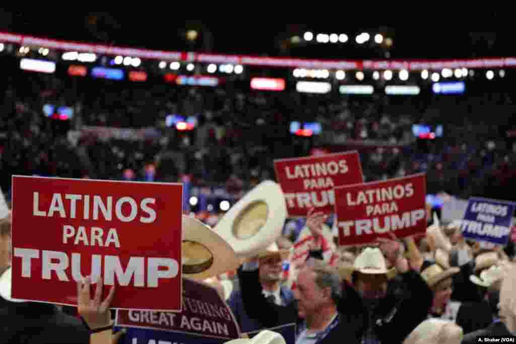 Latino delegates wave signs for Donald Trump at the Republican National Convention, in Cleveland, July 21, 2016.