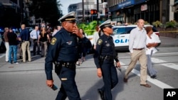 Emergency personnel and police respond to a reported active shooter situation near Fountain Square, Sept. 6, 2018, in downtown Cincinnati, Ohio. 