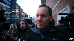 FILE - Harvard University professor Charles Lieber is surrounded by reporters as he leaves the Moakley Federal Courthouse in Boston, Jan. 30, 2020.