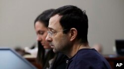 Dr. Larry Nassar is seated during the seventh day of his sentencing hearing, Jan. 24, 2018, in Lansing, Mich.