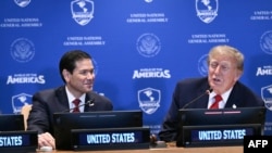 US President Donald Trump (R) and US Secretary of State Marco Rubio take part in a meeting of the Shield of the Americas on the sidelines of the United Nations General Assembly in New York on September 22, 2026. (Photo by Brendan SMIALOWSKI / AFP)