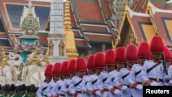 Thai Royal Guards march in front of the Grand Palace during a military parade as a part of a celebration for the upcoming birthday of King Bhumibol Adulyadej in Bangkok, Thailand December 3, 2015.