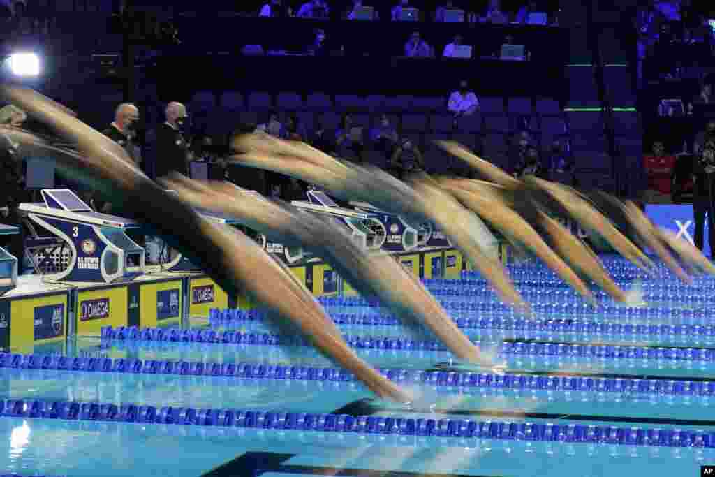 Swimmers start in the women's 200 butterfly during wave 2 of the U.S. Olympic Swim Trials, June 16, 2021, in Omaha, Nebraska.