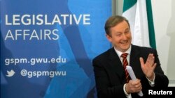 FILE - Irish Prime Minister Enda Kenny applauds his wife, Fionnuala O'Kelly (not pictured), prior to his speech at the George Washington University's Graduate School of Political Management in Washington, March 18, 2013. The prime minister is the focus of