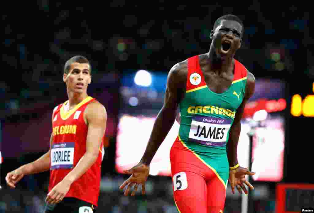 Grenada's Kirani James after winning the men's 400m final. Belgium's Jonathan Borlee stands behind him.