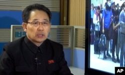 In this image made from video, North Korea's Ministry of Health Director Kim Dong Gun talks about the country's efforts to contain the spread of the new coronavirus, at the Ministry of Health in Pyongyang, North Korea, Jan. 30, 2020.