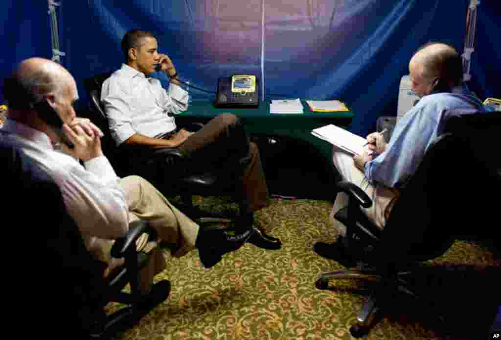 U.S. President Barack Obama is briefed on the situation in Libya on Sunday, during a secure conference call in Rio de Janeiro, Brazil. National Security Advisor Tom Donilon is on the right, Chief of Staff Bill Daley on the left. (Official White House Pho