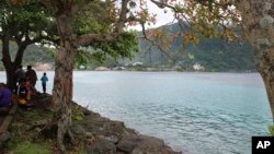 This photo shows people at Utulei Beach Park in Pago Pago, American Samoa on Wednesday, March 4, 2020. The island is among few places on earth without a reported case of COVID-19. (AP Photo/Fili Sagapolutele)