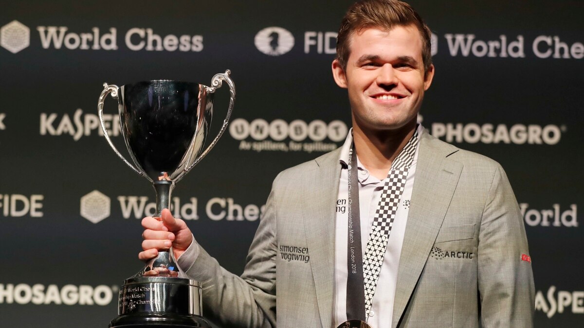 Chess world champion Magnus Carlsen, of Norway, studies the board