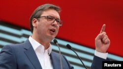 FILE - Serbian Prime Minister and President-elect Aleksandar Vucic speaks during a rally in Novi Sad, Serbia, March 18, 2017. 