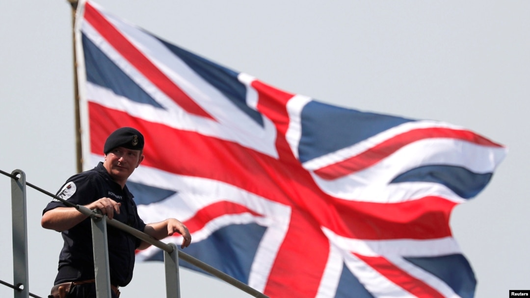 A crew member of the HMS Albion, the British Royal Navy flagship amphibious assault ship, is seen upon the ship's arrival at Harumi Pier in Tokyo, Japan, Aug. 3, 2018. 