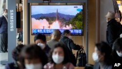 A TV screen showing a news program reporting about North Korea's missile launch with file footage is seen at a train station in Seoul, South Korea, Oct. 19, 2021.