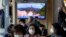 A TV screen showing a news program reporting about North Korea's missile launch with file footage is seen at a train station in Seoul, South Korea, Oct. 19, 2021.