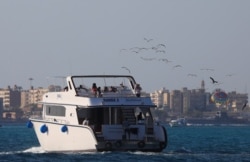 Tourists and Egyptians are seen on the diving ship Randa 2 during a summer vacation at a Red Sea resort, amid the coronavirus disease (COVID-19) outbreak, in Hurghada, Egypt August 25, 2020. (REUTERS/Amr Abdallah Dalsh)