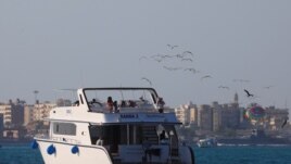 Tourists and Egyptians are seen on the diving ship Randa 2 during a summer vacation at a Red Sea resort, amid the coronavirus disease (COVID-19) outbreak, in Hurghada, Egypt August 25, 2020. (REUTERS/Amr Abdallah Dalsh)