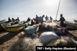 Fishermen gather close to the shore in West Point township, Monrovia, Liberia, May 30, 2018.