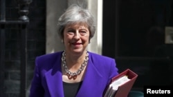 Britain's Prime Minister Theresa May leaves 10 Downing Street in Westminster, London, Britain, July 18, 2018. 