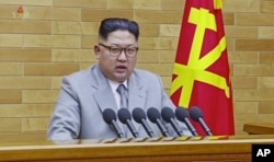 FILE - In this image made from video released by KRT on Jan. 1, 2018, North Korean leader Kim Jong Un delivers his annual address from an undisclosed location in North Korea.