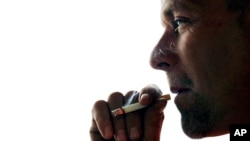 FILE - A new study suggests smoking may permanently damage DNA.