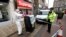 Police officers secure an area in the town center after reports of a stabbing in Barnsley, England, Sept. 8, 2018.