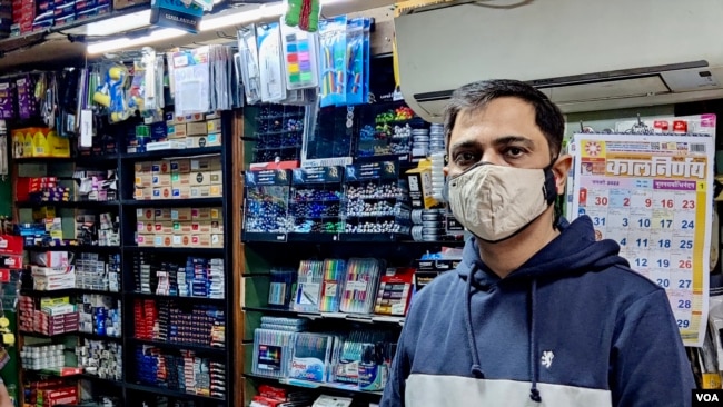 Sanjay Kapur, owner of a stationery store in the business hub of Gurugram, says business remains sluggish as most offices and schools still remain shut. (Anjana Pasricha/VOA)