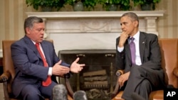 President Barack Obama listens to Jordan's King Abdullah II during their meeting in the Oval Office of the White House in Washington, April 26, 2013. 