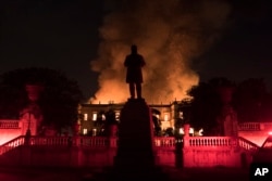 Flames engulf the 200-year-old National Museum of Brazil, in Rio de Janeiro, Sept. 2, 2018.