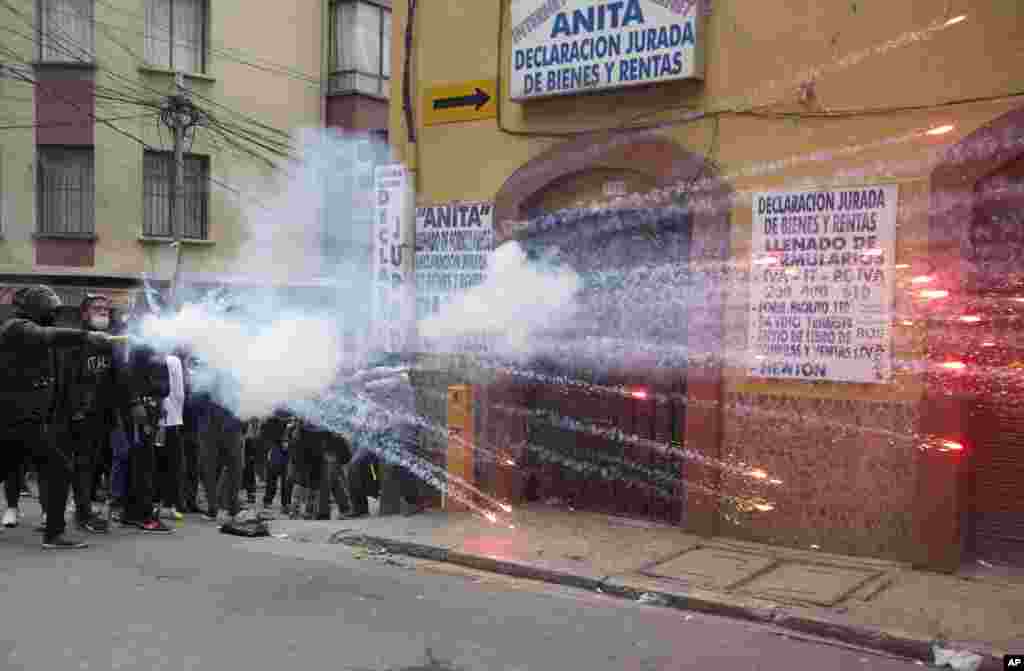 Student protesters launch fireworks at police during clashes in La Paz, Bolivia, June 13, 2018. Protesters demanded an increase in the public university budget and for justice of the death of a young man who was killed during street demonstrations three weeks ago.