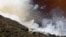 Helicopters drop fire retardant and water over the BlueCut fire in the Cajon Pass near San Bernardino, California, Aug. 17, 2016. 