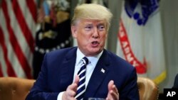 President Donald Trump speaks during talks on sanctuary cities with law enforcement officers in the Roosevelt Room of the White House, in Washington, March 20, 2018.