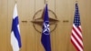 Прапори Фінляндії, НАТО та США під час зустрічі міністрів закордонних справ країн альянсу у Брюсселі. Johanna Geron, Pool Photo via AP

