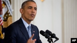 President Barack Obama speaks during a news conference in the State Dining Room of the White House in Washington, Oct. 2, 2015.