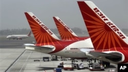 FILE - Air India planes are parked at Indira Gandhi International Airport in New Delhi. 