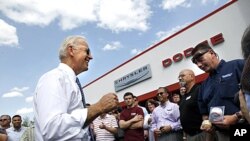 Vice President Joe Biden speaks to workers at Bonneville & Son's car dealership in Manchester, New Hampshire, May 25, 2011