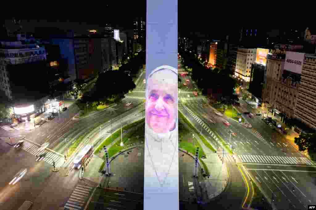 An aerial view shows the Obelisk illuminated with the image of Pope Francis as he recovers in hospital, in Buenos Aires.