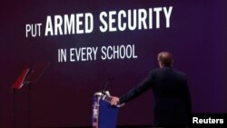 NRA Executive Vice President and CEO Wayne LaPierre watches an NRA promotional video while speaking at the Conservative Political Action Conference (CPAC) at National Harbor, Maryland, U.S., Feb. 22, 2018. 