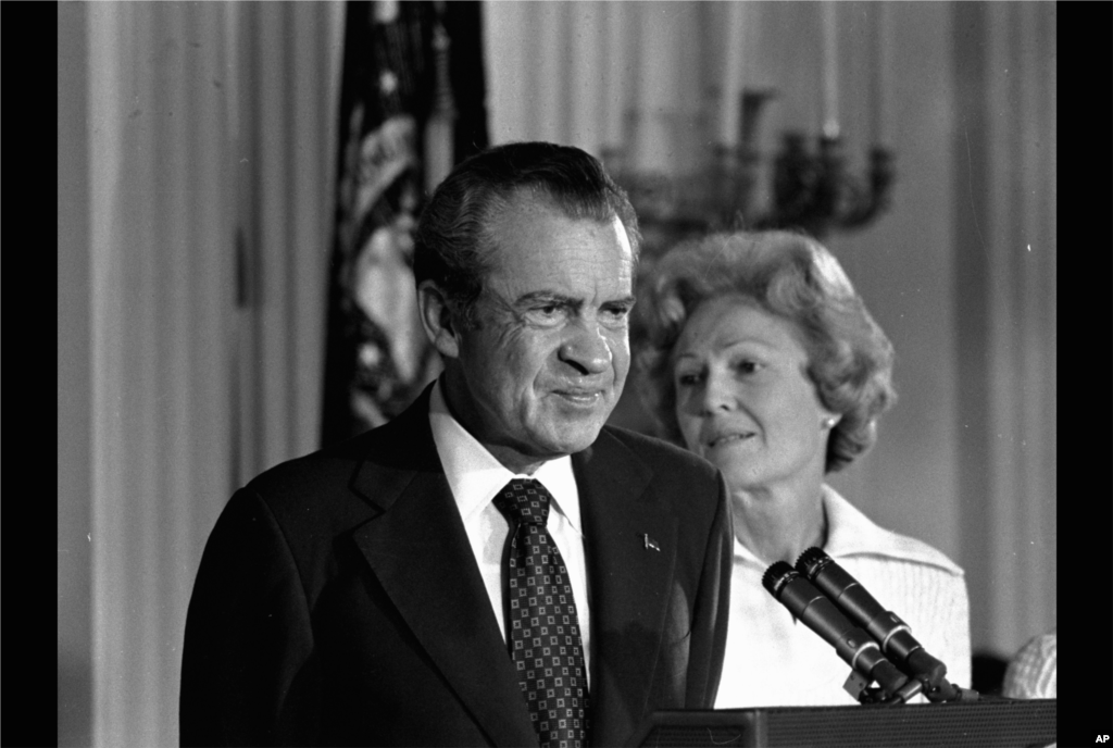 President Richard M. Nixon and his wife Pat Nixon are shown standing together in the East Room of the White House in Washington August 9, 1974. (AP Photo)