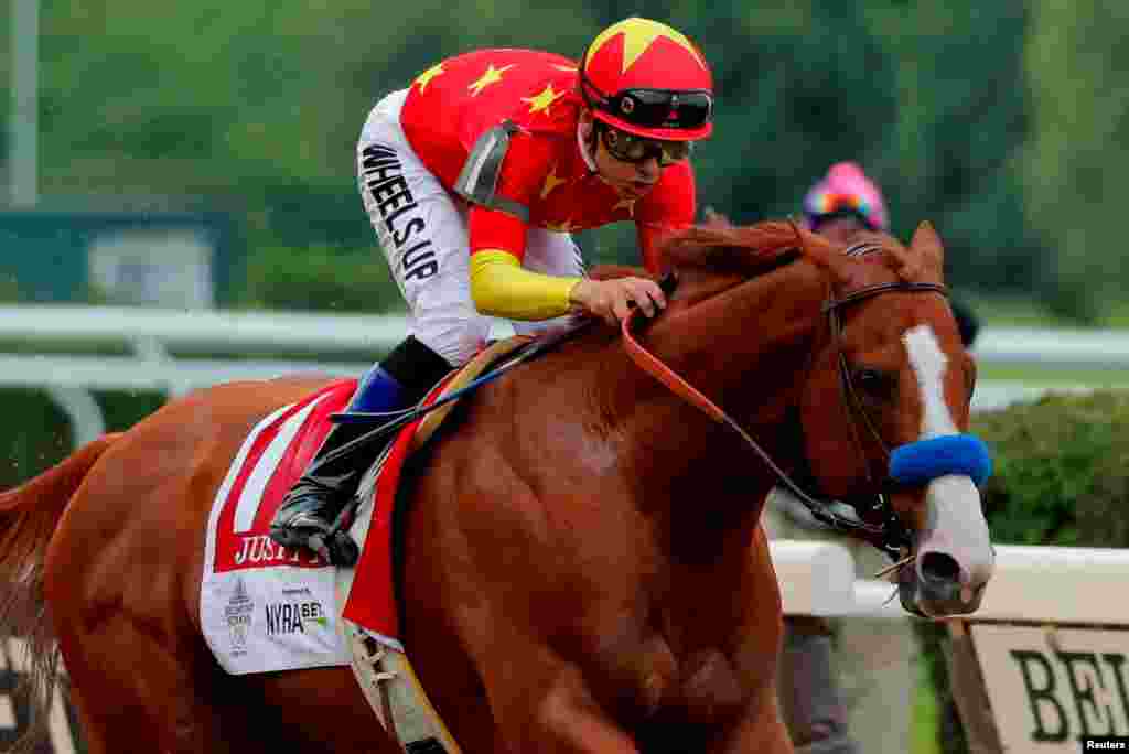 Justify with jockey Mike Smith aboard wins the 150th running of the Belmont Stakes, the third leg of the Triple Crown of Thoroughbred Racing at Belmont Park in Elmont, New York, June 9, 2018.