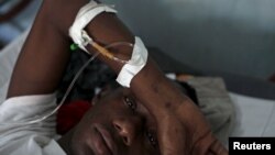 Givenchi Predelus suffers from Cholera at the Cholera Treatment Center run by the Haitian Ministry of Public Health and Population in collaboration with Doctors Without Borders, Port-au-Prince, Haiti, April 13, 2015.