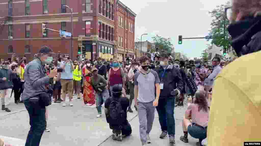 Minneapolis Mayor Jacob Frey walks from a crowd of protesters, in the aftermath of the death in Minneapolis police custody of George Floyd, in Minneapolis, Minnesota, June 6, 2020, in this still image obtained from a social media video. (Courtesy of CTUL)