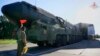 In this photo taken from video released by Russian Defense Ministry Press Service on Sept. 17, 2024, a Russian RS-24 Yars strategic ballistic missile launcher moves out of a hangar during a drills in Ivanovo region, Russia.