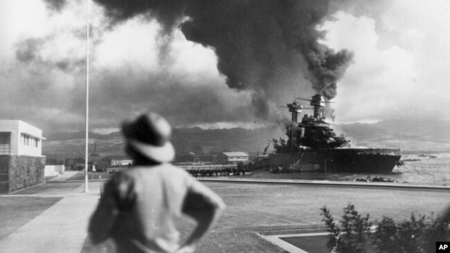 FILE - American ships burn during the Japanese attack on Pearl Harbor, Hawaii, in this Dec. 7, 1941 file photo.