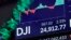 A board above on the trading floor of the New York Stock Exchange shows the closing number for the Dow Jones industrial average, Feb. 6, 2018.