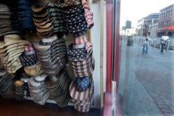 Hats are displayed in a clothing store closed because of the COVID-19 pandemic Tuesday, April 21, 2020, in Nashville, Tenn.