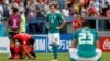 German midfielder Mesut Ozil, center, reacts after a 2-0 loss to South Korea that eliminated Germany from the World Cup, June 27, 2018, in Kazan Arena in Kazan, Russia.