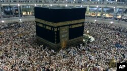 FILE - Muslim pilgrims circle the Kaaba, the black cube at center, inside the Grand Mosque during the annual pilgrimage, known as the hajj, in the Muslim holy city of Mecca, Saudi Arabia. 